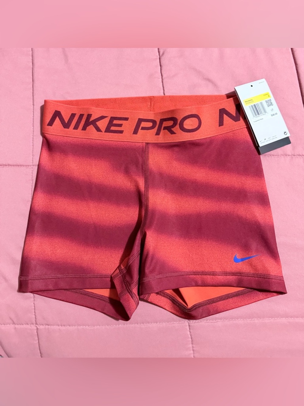 Nike Pro Women's Coral-Red Bike Shorts with Blue Swoosh